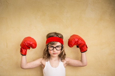 44203960 - funny strong child. girl power and feminism concept Clout