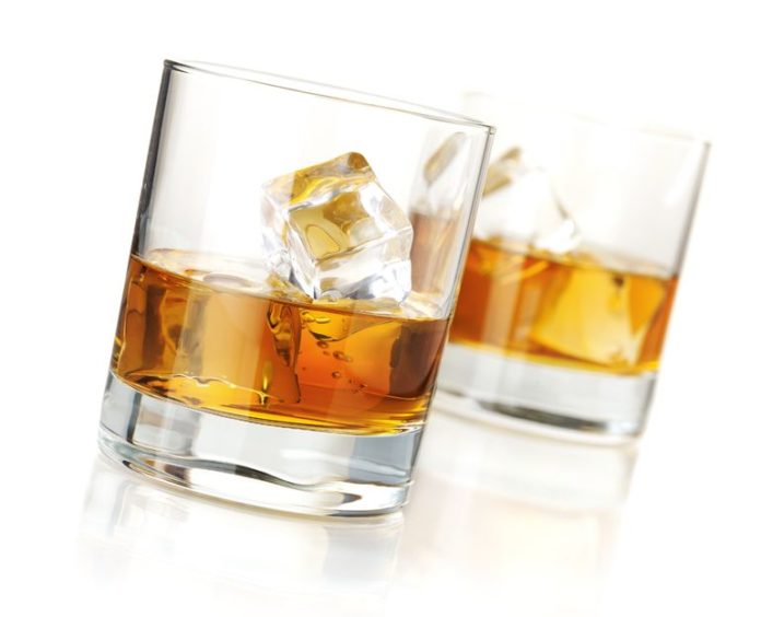 7967646 - two whiskey glasses. isolated on white with reflection