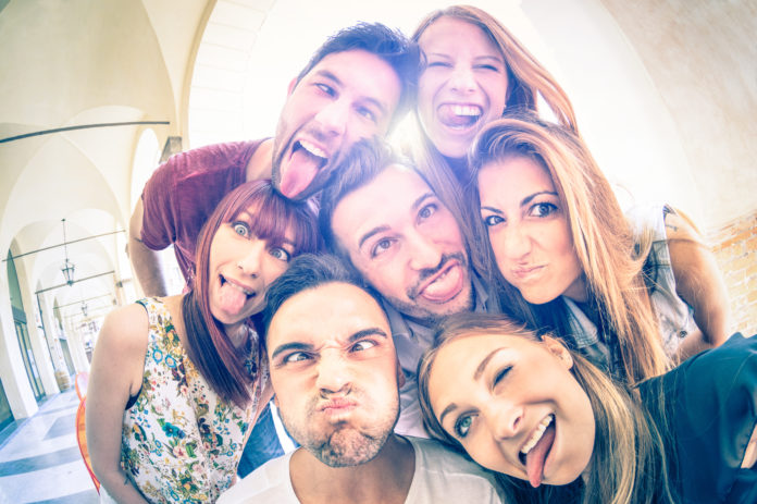 Best friends taking selfie and having fun outdoors