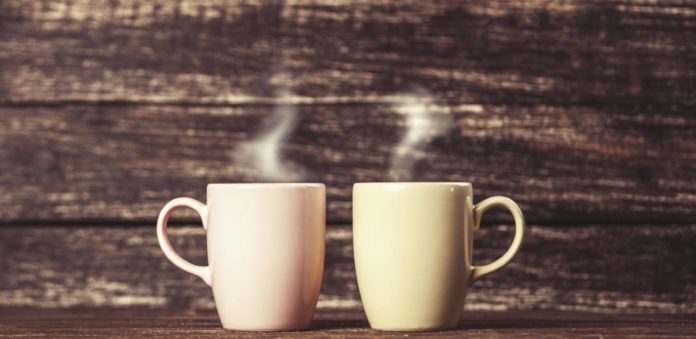 m-Two-cups-of-coffee-on-wooden-table-000044323704_Large