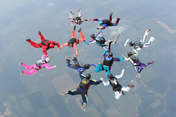 12 skydivers complete a formation in freefall